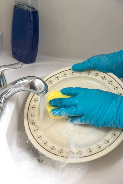 Woman Hands Gloves Wash Plate Running Water Close — стоковое фото