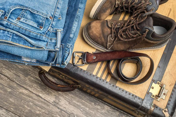 Worn Boots Belt Stack Blue Jeans Lie Vintage Suitcase Concept — Stock Photo, Image