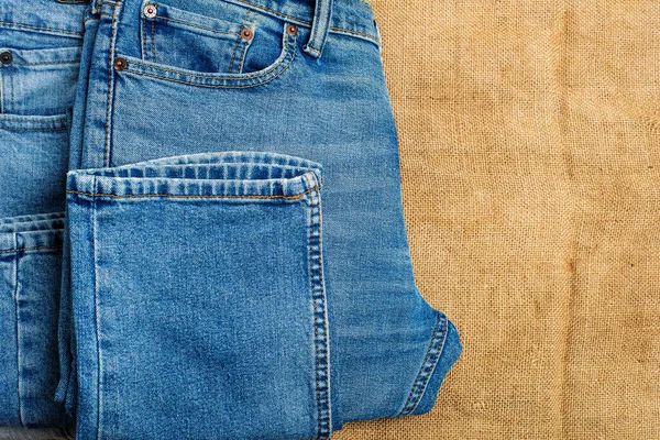 Blue Classic Jeans Close Lie Background Old Burlap View Copy — Stock Photo, Image