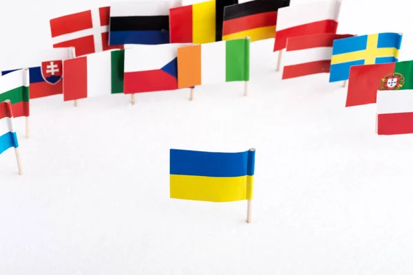 flag of Ukraine against the background of the flags of European countries. European countries do not accept Ukraine into the European Union.  Selective focus.