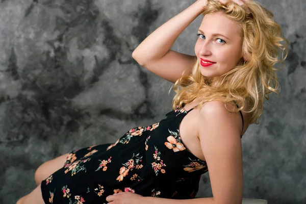 Portrait Lying Beautiful Blonde Black Red Dress Smiling Looking Camera — Stock Photo, Image