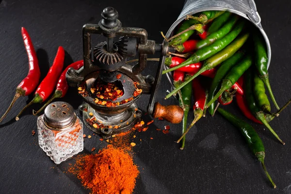 Mill Finely Ground Red Hot Pepper Pepper Pods Black Table — Stock Photo, Image