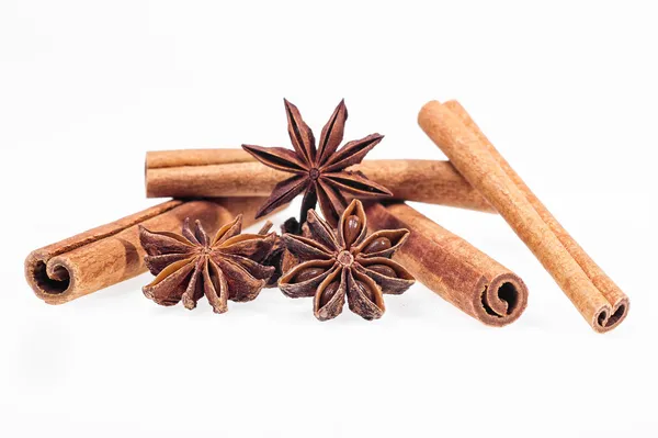 Cinnamon, anise and cloves on white background — Stock Photo, Image