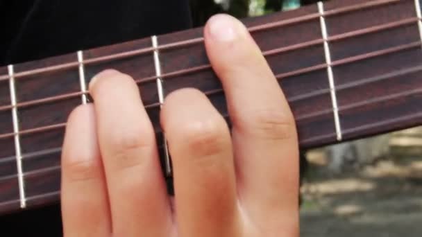 Playing at guitar — Stock Video