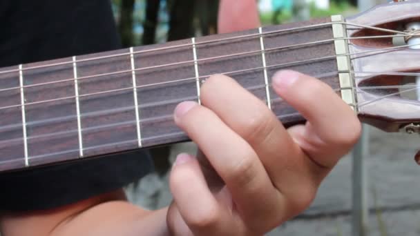 Playing at guitar — Stock Video