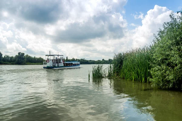 small tourist boat on Danube delta, Vylkove city on the Ukrainian part of the Danube Delta, Odessa region, Ukraine