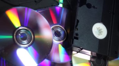 close-up a many compact discs and some hi-8, vhs and dv-cam video casettes panorama