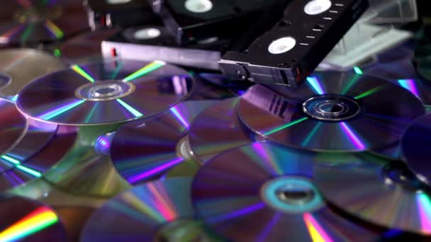 Close Many Compact Discs Some Video Casettes Moving Lights — Vídeo de Stock