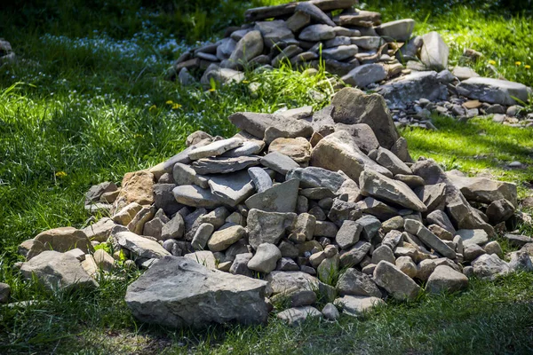 close-up of a pile of stones on the grass