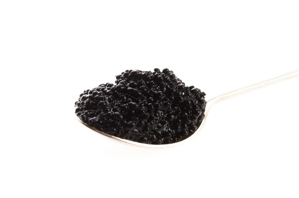 Caviar preto na colher no fundo branco — Fotografia de Stock