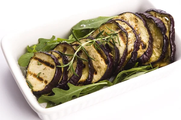 Grilled eggplant slices on a plate with fresh rosemary — Stock Photo, Image