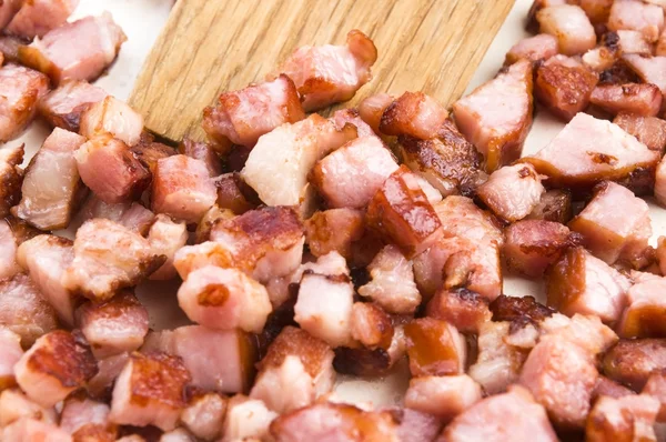 Macro foto de tocino frito en una sartén — Foto de Stock