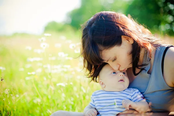 Mother Kissing Her Little Son — Stock Photo, Image