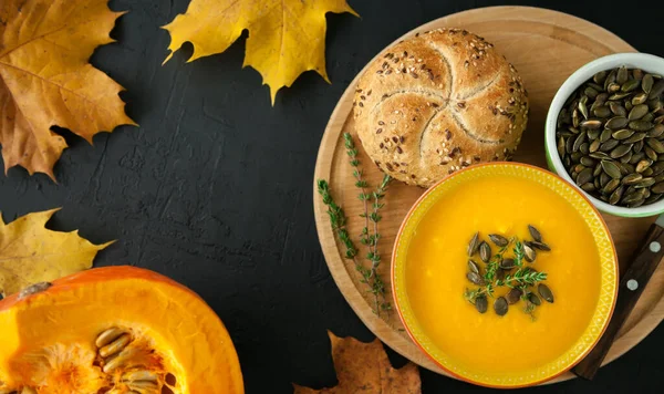 Top View Autumn Vegan Homemade Pumpkin Soup Seeds Herbs Bun — Stock Photo, Image