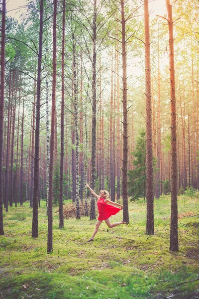 Young Happy Blond Woman Red Dress Dancing Pine Forest — Stock Photo, Image