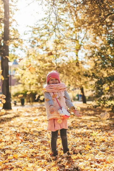 Smiling Cute Little Girl Throwing Autumn Maple Leaves Playing Sunny — Stock Photo, Image