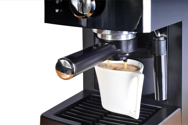 Кофеварка с чашкой кофе — стоковое фото