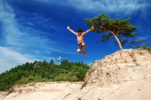 Boy Jumping Off Cliff — Stock Photo, Image