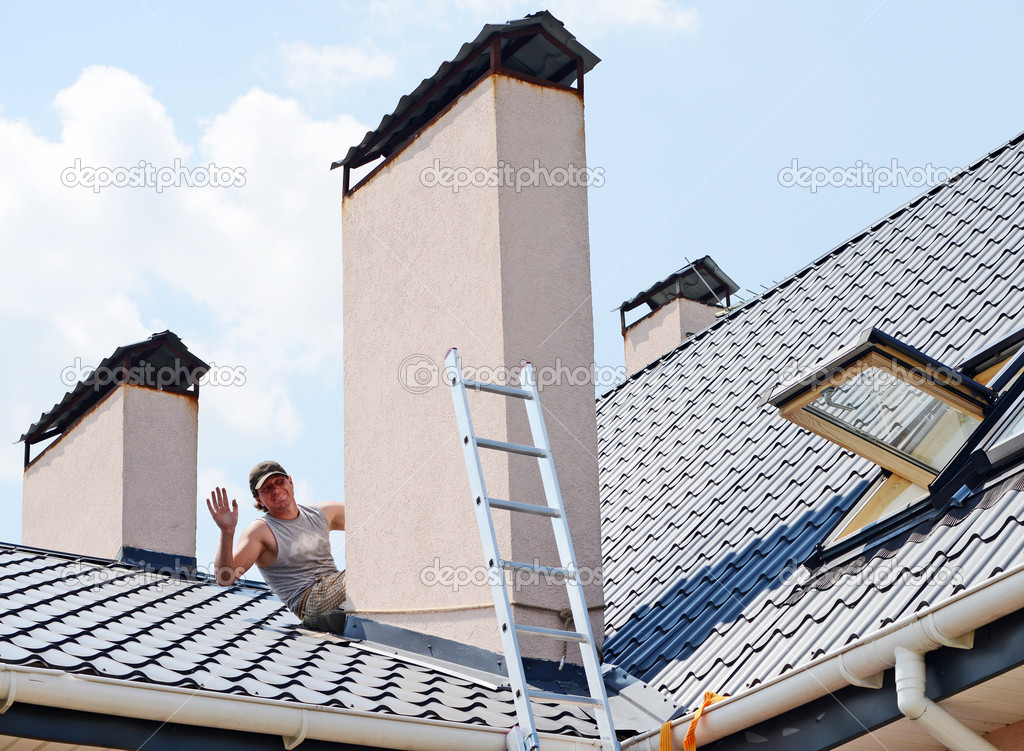 Construction workers repairing roof