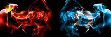Flags of China, Chinese vs Japan, Japanese, Sobetsu,_Hokkaido, Iburi, Subprefecture. Smoke flag placed side by side on black background. 