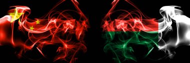 Flags of China, Chinese vs Madagascar. Smoke flag placed side by side on black background. 