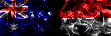 Avustralya bayrakları, Avustralya, Endonezya, Endonezya. Duman bayrağı siyah arkaplanda yan yana yerleştirildi. 