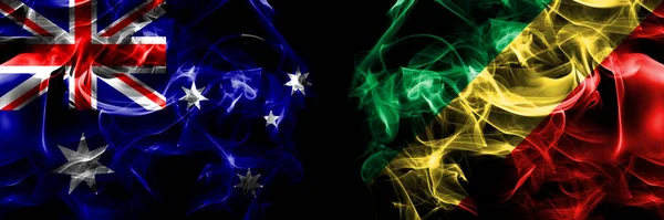 オーストラリア オーストラリア対コンゴ コンゴの旗 黒地に煙旗を並べて — ストック写真