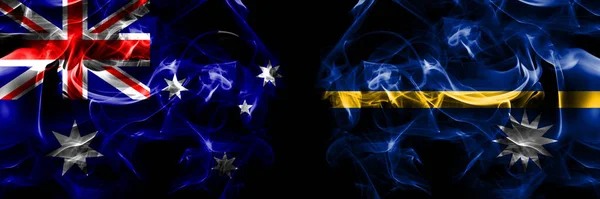 澳大利亚国旗 澳大利亚人对瑙鲁 烟旗并排放置在黑色背景上 — 图库照片