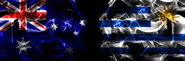 オーストラリア オーストラリア対ウルグアイ ウルグアイの旗 黒地に煙旗を並べて — ストック写真