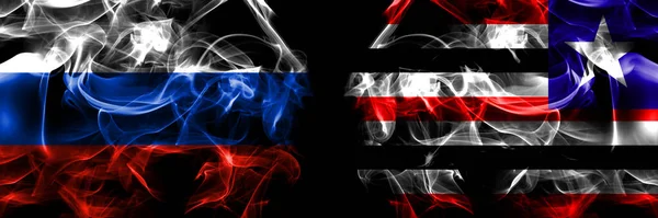 俄罗斯 俄罗斯对巴西 马兰霍国旗 在黑色背景下并排隔离的烟雾旗 — 图库照片