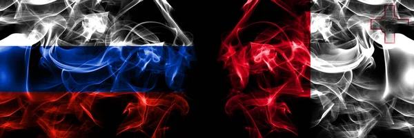 ロシア ロシア対マルタ マルタの旗 黒地に隔絶された煙旗 — ストック写真