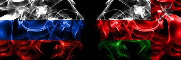 Rusland Russische Oman Vlaggen Rookvlag Naast Elkaar Geplaatst Zwarte Achtergrond — Stockfoto