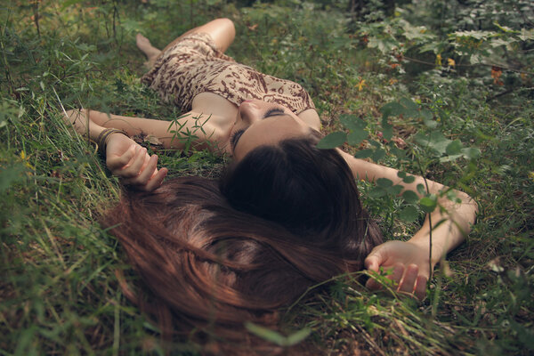 Beautiful mysterious woman in forest