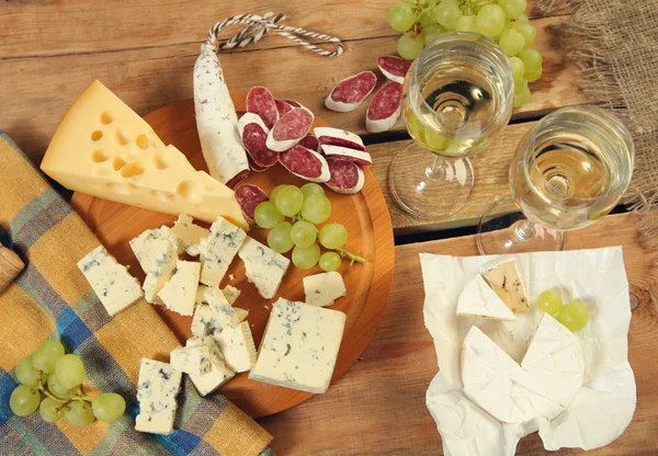 Fruits and cheeses — Stock Photo, Image