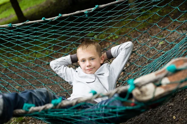 Boy lying on a hammock — Stock Photo, Image