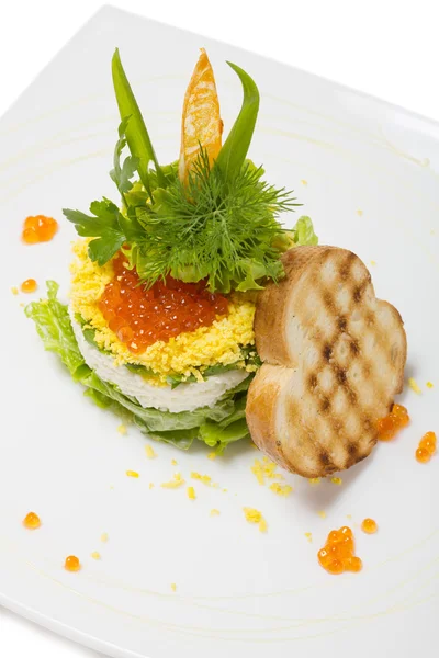 Salad of boiled shrimp under a dome of red caviar. — Stock Photo, Image