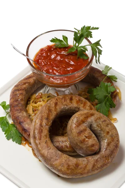 Grilled spicy sausage with sauerkraut — Stock Photo, Image