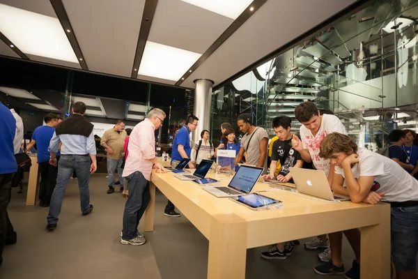 Buyers and sellers in the Apple store in Hong Kong.