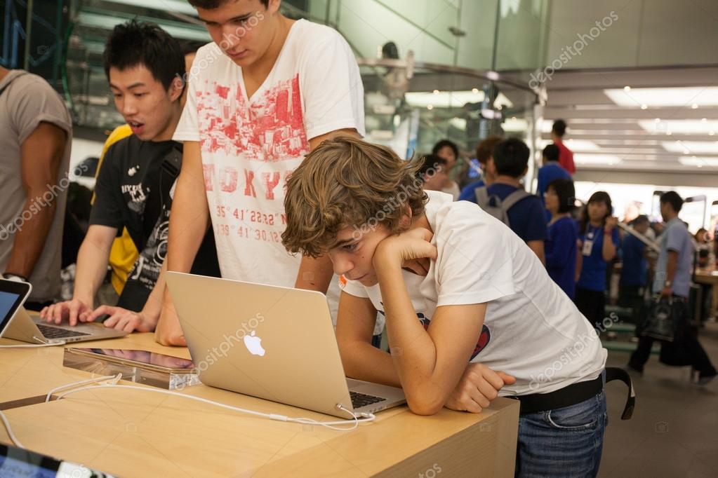 HONG KONG, CHINA - NOVEMBER 11, 2012: Buyers and shop assistants at Apple store in Hong Kong. Store is in a shopping center IFC Mall, it is very popular with locals and tourists visiting Hong Kong.