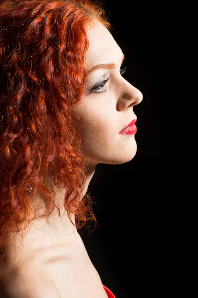 Beautiful girl with curly red hair — Stock Photo, Image