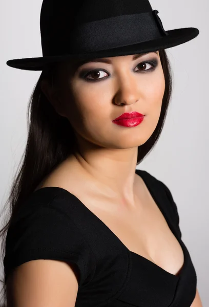 Charming young woman Asian in hat — Stock Photo, Image