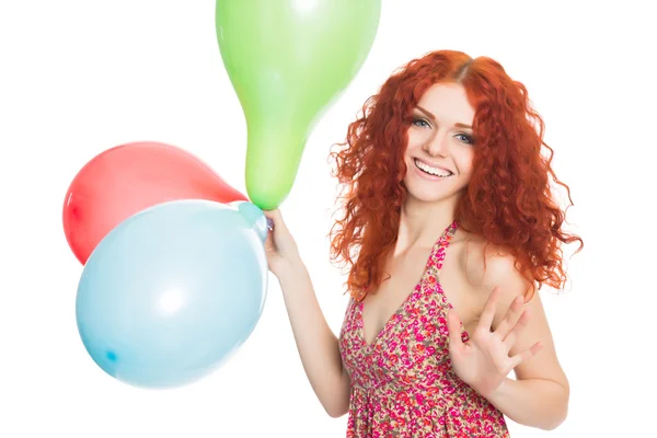 Chica alegre sosteniendo globos de colores — Foto de Stock