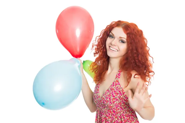 Glückliche junge Frau mit bunten Luftballons — Stockfoto