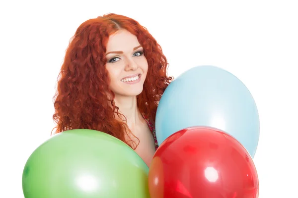 Menina alegre segurando balões coloridos . — Fotografia de Stock