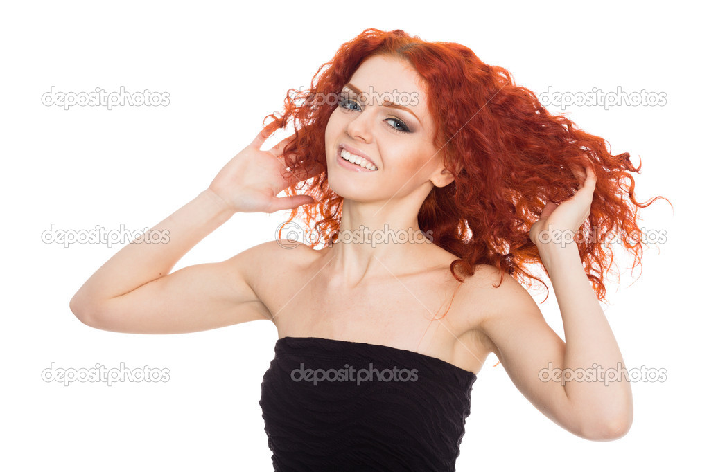 Joyful young woman with arms raised