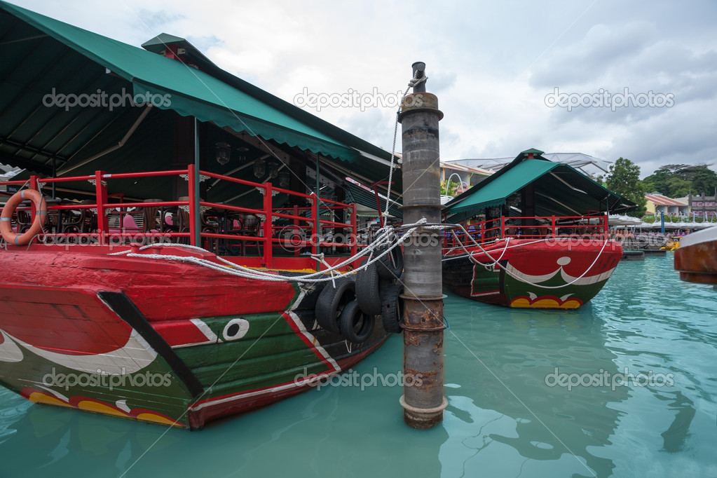 Tourist boat berths Riverside in Singapore.