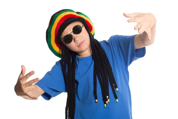 European boy in a cap with dreadlocks sings rap — Stock Photo, Image