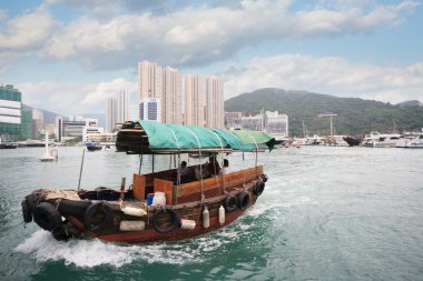 Fishing boat in Aberdeen harbor in Hong Kong clipart