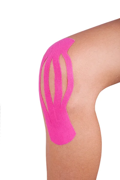 Knee treated with kinesio therapy — Stock Photo, Image