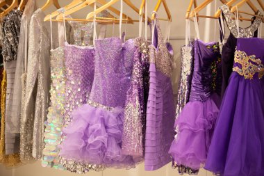 Glitter dresses in a store clipart